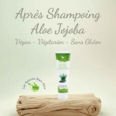 Après-shampoing Aloe-Jojoba Forever, 296 ml, végan et sans gluten posé sur du bois flotté